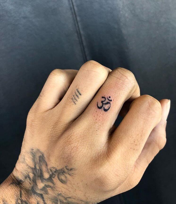 om tattoo design on finger 1