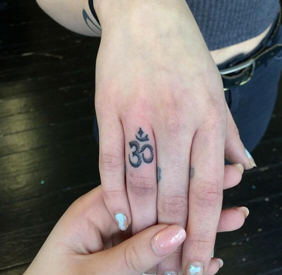 om tattoo designs on finger 2