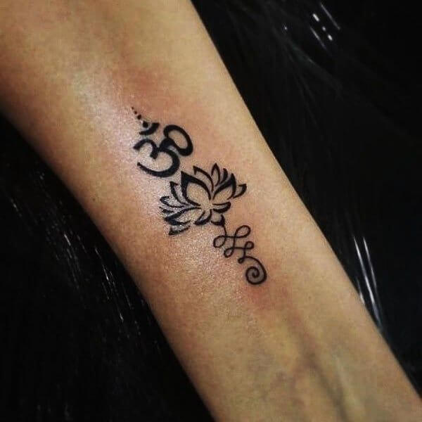 simple om tattoo design on wrist