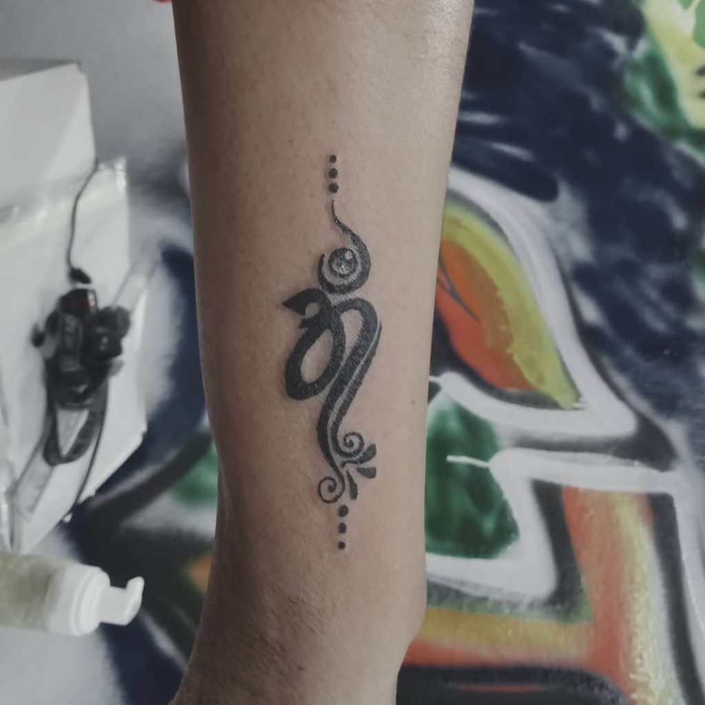 simple om tattoo design with dots